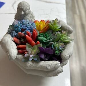 A bird in his hands holding flowers